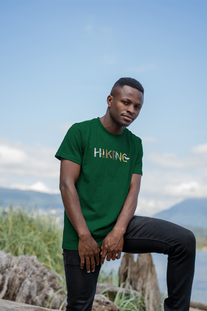 Model wearing the Adventure in Letters Tee by VELU, crafted from organic cotton and hemp, perfect for eco-conscious outdoor enthusiasts.