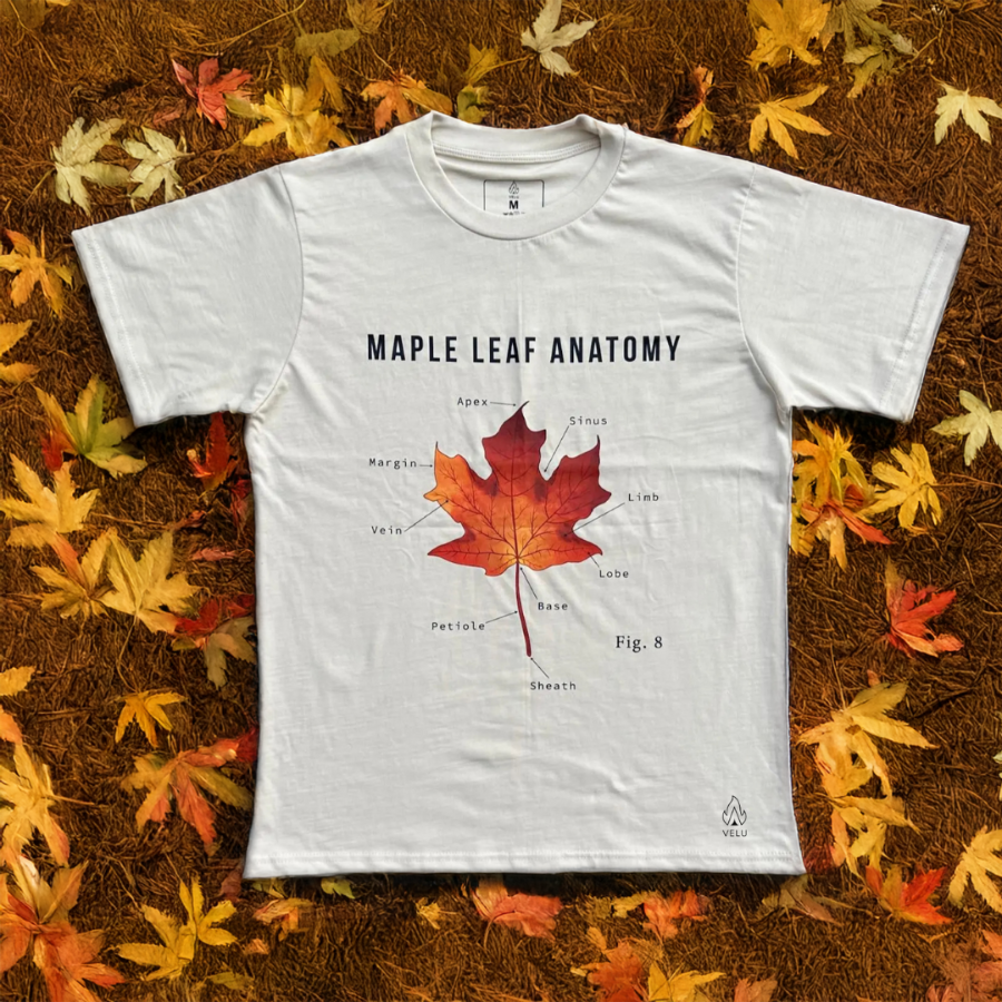 Flatlay of the Maple Essence Tee by VELU, crafted from organic cotton and hemp, featuring a maple leaf anatomy design for a sustainable fashion statement.