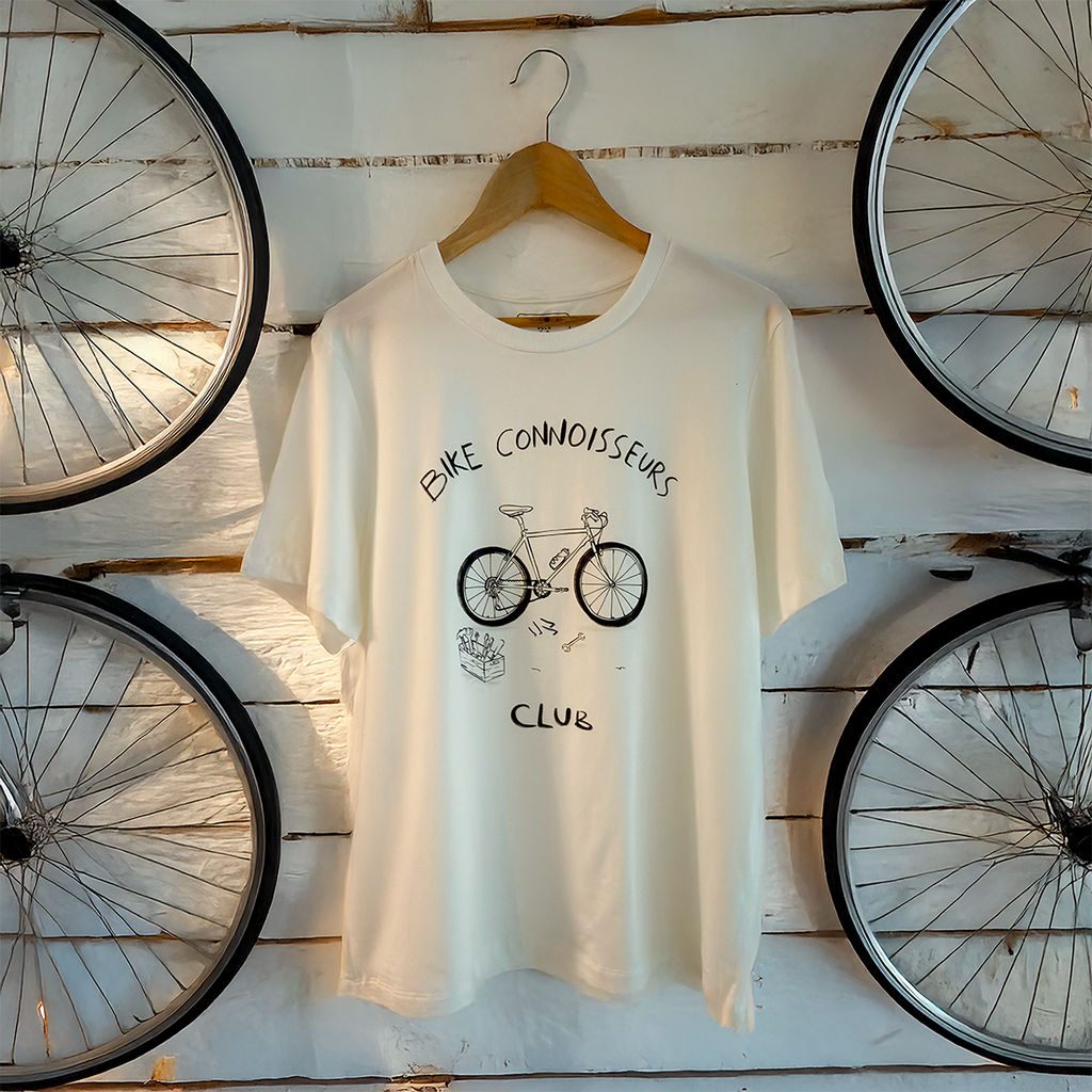 Ivory sustainable t-shirt by VELU with a minimalist “Bike Connoisseurs Club” bicycle illustration. Ethically made in Vancouver from a lyocell and organic cotton blend.