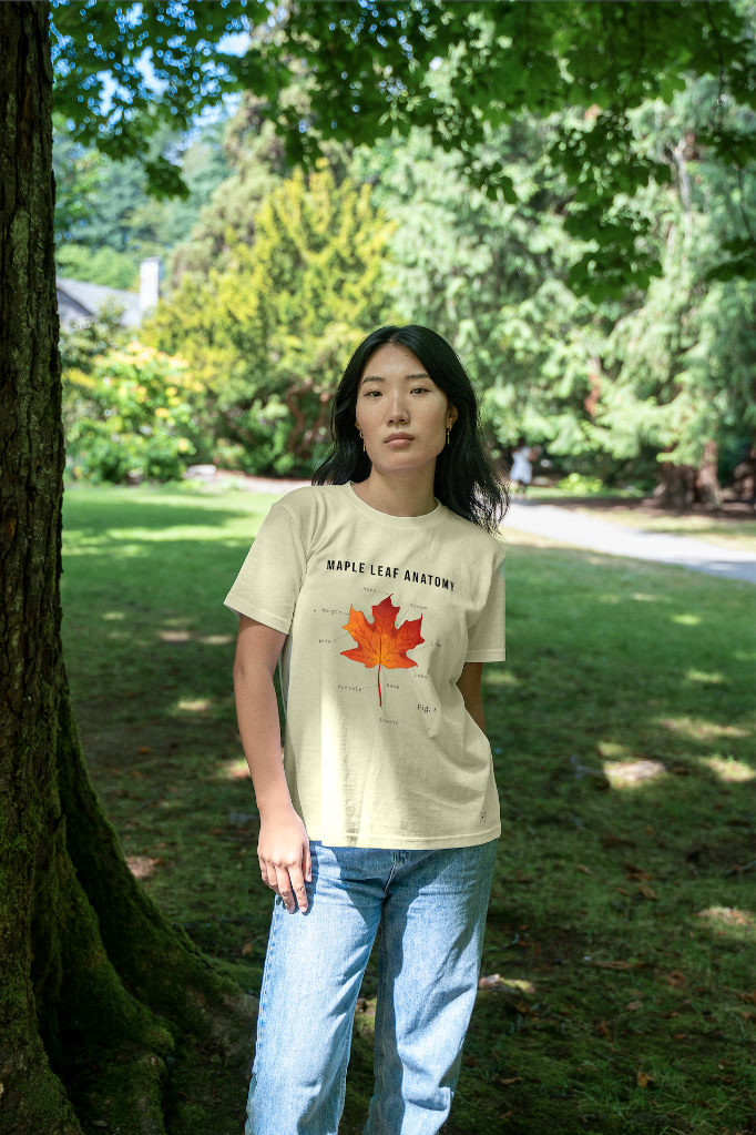 Model wearing the Maple Essence Tee for women by VELU in a natural outdoor setting